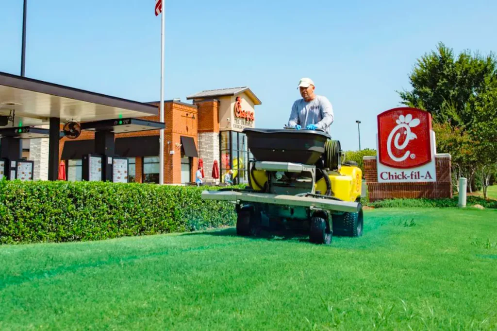 Willis commercial landscaper mowing Chick-fil-a