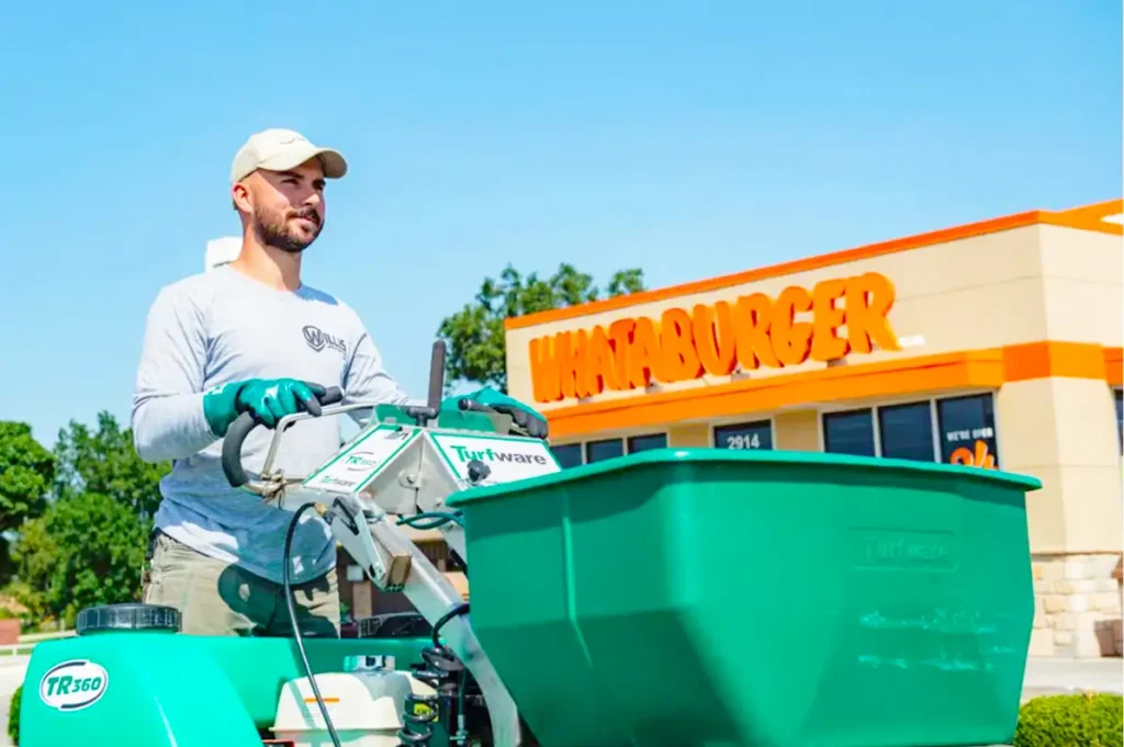 Willis commercial landscaper fertilizing Whataburger